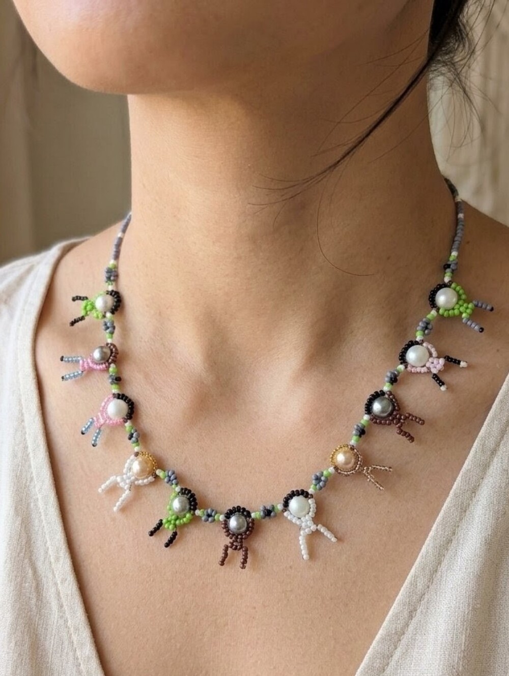Beaded People Necklace With Faux Pearls
